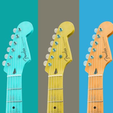 An image of fix guitar heads each a different color, possibly owned by a female indie rock artists or singer.