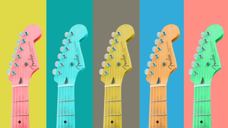 An image of fix guitar heads each a different color, possibly owned by a female indie rock artists or singer.